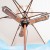 Zwarte elektrische terrasverwarmer gemonteerd op parasol